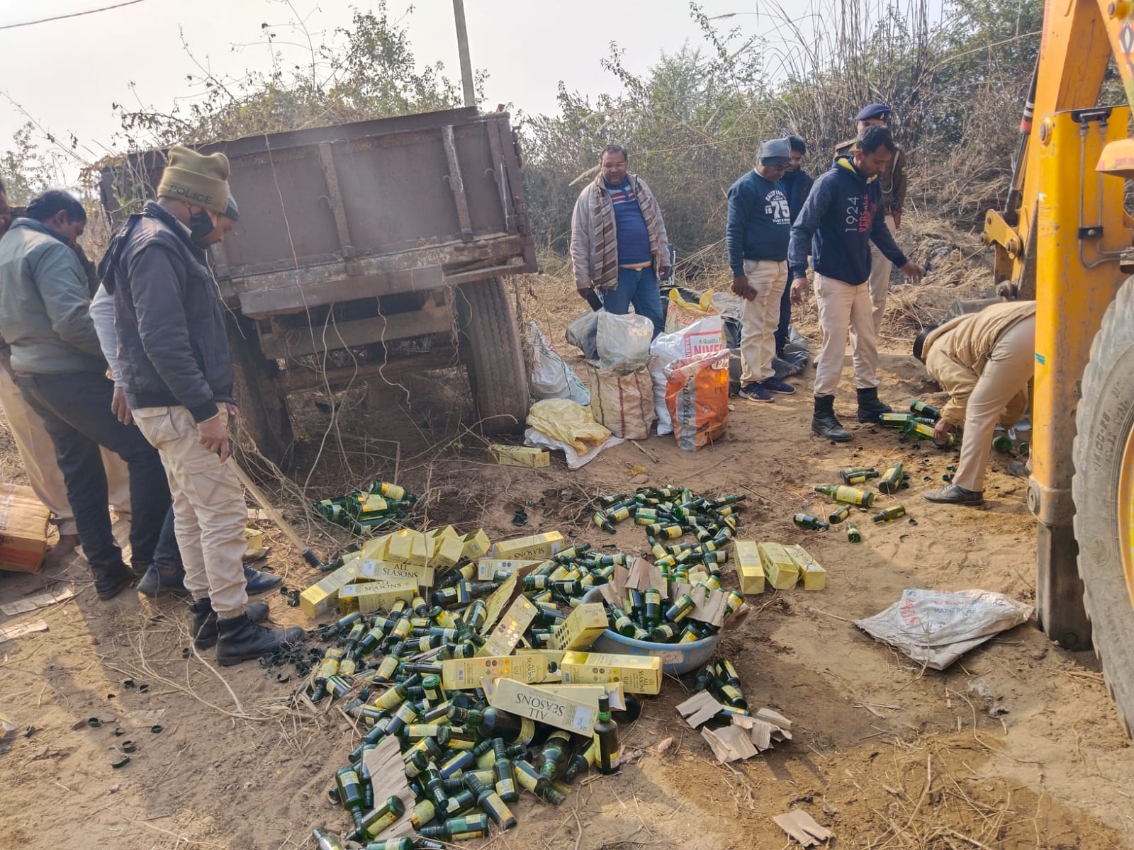 Bihar police destroying seized liquor in Gaya district